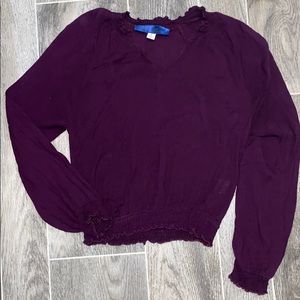 Long sleeve deep purple crop top.